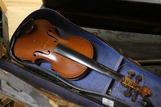 Three half size violins, a quantity of bows and six violin cases